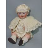 Bisque head baby doll by Kestner, composition body with bent limbs, fixed blue eyes and open