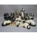 A collection of models of Siamese cats including Beswick and Royal Doulton examples, example by