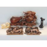 Chinese carving of Buddha pulling a sack with various mice, 39 cm long together with two further oak