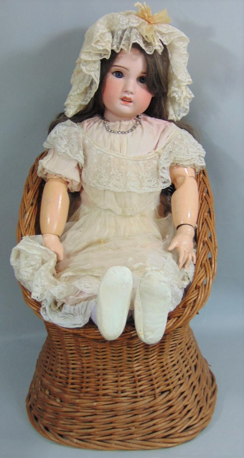 Early 20th century SFBJ bisque socket head doll, 82cm tall, feathered brows, brown eyes, open