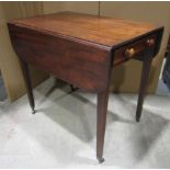 A 19th century mahogany Pembroke table fitted with the usual arrangement of one real and one dummy