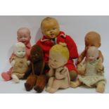 Collection of 7 small dolls including a Norah Welling black velvet doll in dungarees, a bisque