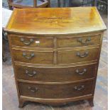 A small Edwardian mahogany chest of two long and four short drawers with bow fronted outline on