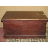 A vintage stained mixed wood blanket box with hinged lid enclosing candle box to interior