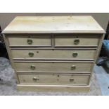 A 19th century stripped pine bedroom chest of two short over three long gradated drawers set on a