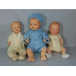 3 dolls; A Hugo Wiegand all composition baby doll, c.1920, with brown glass sleeping eyes, open