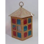 An Arts & Crafts copper hall lantern of square form with frosted glazed panels within a riveted