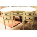 An Edwardian mahogany ladies dressing table with inverted kidney shaped front, the front elevation