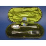 Cased silver fork and spoon set together with a further silver napkin ring and cased Milano his