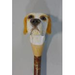 An unusual walking staff with carved dog head knop, 140 cm high