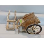 A vintage wooden scale model cart with two spoke wheels