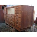 A vintage oak haberdashery cabinet/counter incorporating a brass framed and glazed centralised