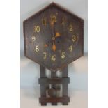 Arts & Crafts oak hexagonal drop dial wall clock, with applied brass Arabic numerals, 80 cm long,