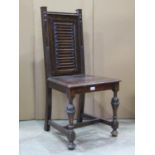 An old English style oak panel back single chair with linen fold and applied split moulded detail,