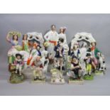 A collection of mainly 19th century Staffordshire figure groups including a pair of harvesters,