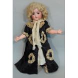 Bisque head doll by Kammer & Rheinhardt with composition jointed body, sleeping brown eyes,