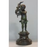 Good quality 19th century patinated bronze figure of a standing child wearing a devils mask, upon
