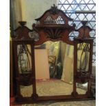 An Edwardian mahogany overmantel mirror, the framework enclosing five bevelled edge plates of