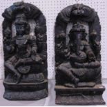 Matched pair of carved Eastern ebonised wall hanging panels, depicting Shiva and Ganesh, both 60
