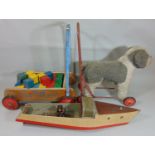 Vintage push along toy dog by Vylena together with a Triang baby walker with bricks and a hand built