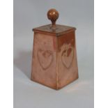 An Arts & Crafts copper caddy of square tapered form complete with lid with repeating heart detail