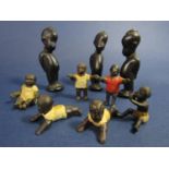 Six small lead figures (all painted) - African children at play and three carved timber figures of