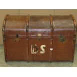 A vintage timber lathe bound domed top cabin trunk with stitched leather side carrying handles and