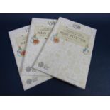Three folding folios each containing five uncirculated 50p coins, Peter Rabbit, Jemima Puddleduck,
