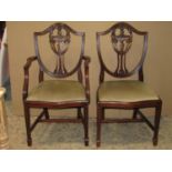 A set of six (4&2) reproduction Hepplewhite style shield back dining chairs with pierced urn