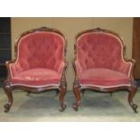 A pair of Victorian spoonback drawing room chairs with upholstered seat, button back and arms within