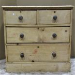 A small Victorian stripped pine bedroom chest of two short over two long graduated drawers later set