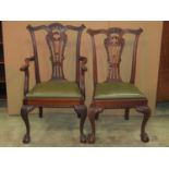 A set of six (4&2) Chippendale revival dining chairs with pierced and scrolled gothic tracery splats