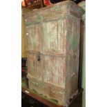 A rustic antique pine side cupboard probably Indian freestanding and enclosed by a pair of three