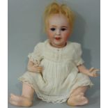 Small character doll marked 'SFBJ 236 Paris 0', Laughing Jumeau type,with bisque head closing blue