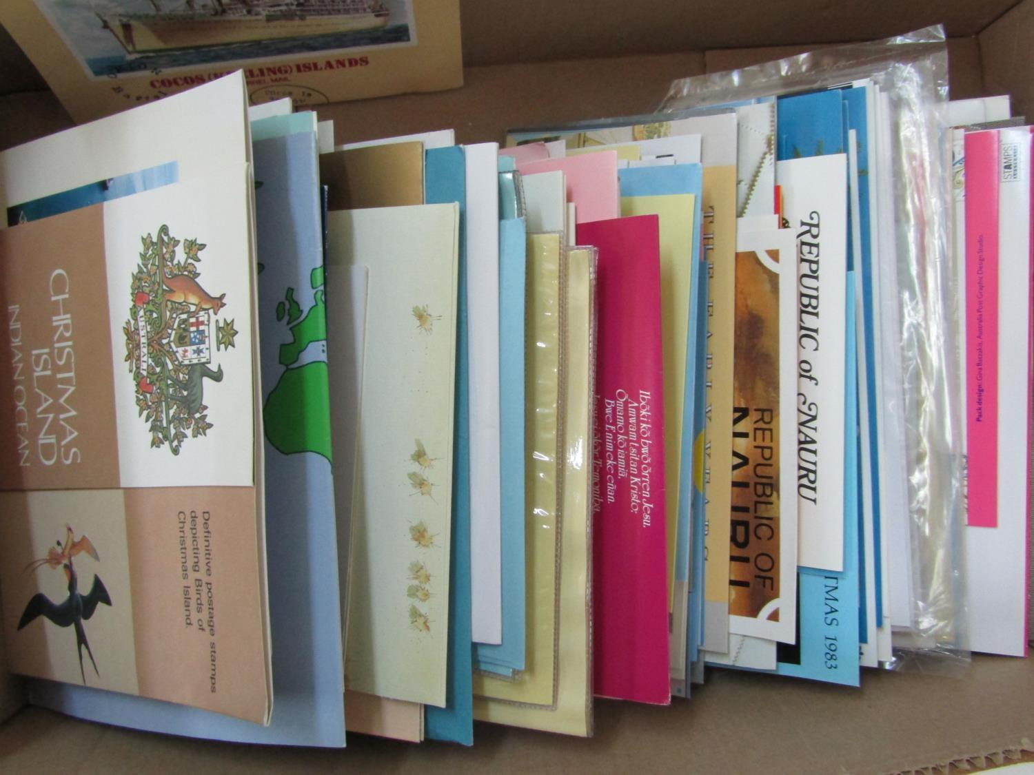 A box of Australia presentation packs with content also some Cocos Keeling, Christmas Island(