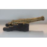 18th century brass signalling cannon, spiked set on the original oak stand, 38cm overall