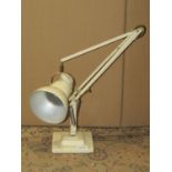 A vintage Herbert Terry anglepoise table lamp with two stepped square base and cream colourway