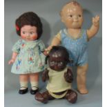 3 composition dolls; early 20th century doll with Kewpie body shape, googly eyes, pedestal legs,