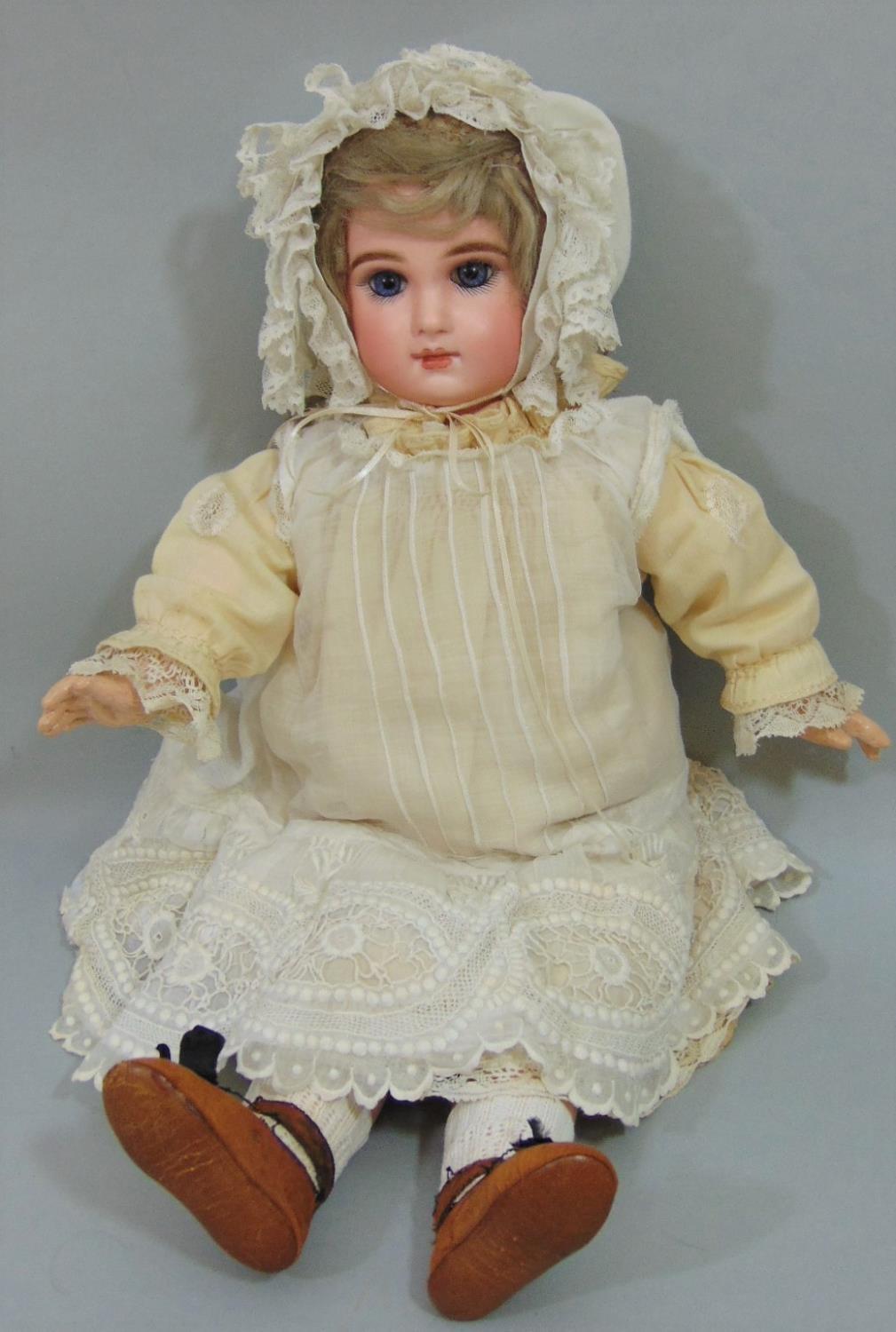 Jumeau bisque socket head doll with jointed composition body, with fixed blue eyes, painted