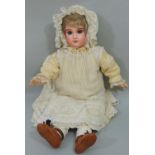 Jumeau bisque socket head doll with jointed composition body, with fixed blue eyes, painted