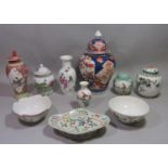 A collection of oriental ceramics including a vase and cover in the imari manner, a further pink