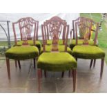 A set of seven Georgian mahogany splat back dining chairs with carved and pierced detail,