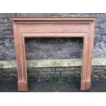 A reclaimed stripped pine fire surround with dentil and bead moulded detail, 135 cm wide x 130 cm