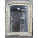 A late 19th century wall mirror, the moulded arched frame with repeating foliate border and gilt