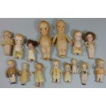 Collection of small all bisque Kewpie type dolls mostly 1920's, including miniatures with jointed