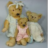 3 1930's Merrythought bears; a large teddy bear with glass eyes, stitched mouth, nose and claws,