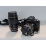 Canon EOX 100 camera with 28-80mm lens and further 100-300 lens within a Leman camera bag