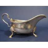 Georgian style cast silver sauce boat with S scroll handle and scallop shell cabriole hoof feet,