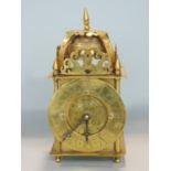 Unusual brass coronation lantern clock with brass chapter ring the brass back plate inscribed E R