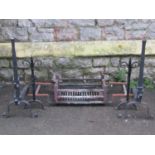 A cast iron fire basket and loose dogs together with a pair of old English style andirons with